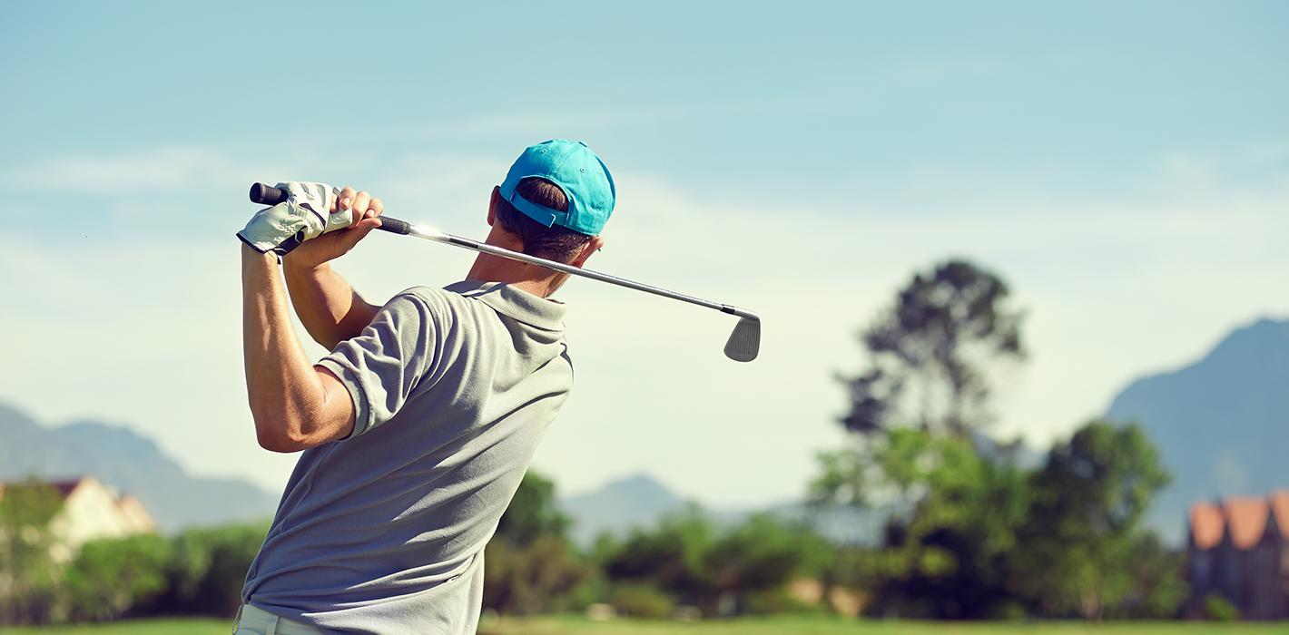 man playing golf pain free